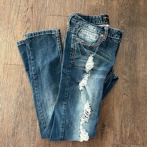 Size 3/4R twenty one black ripped dark jeans.  By Rue 21.